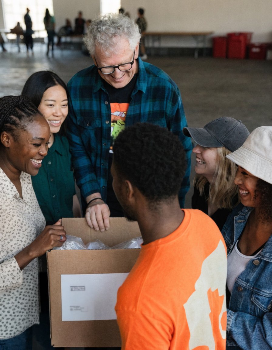 Volunteers gathered around a donation box at a community event